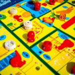 Image of vintage 90s strategy board games, including popular titles like Risk and Settlers of Catan